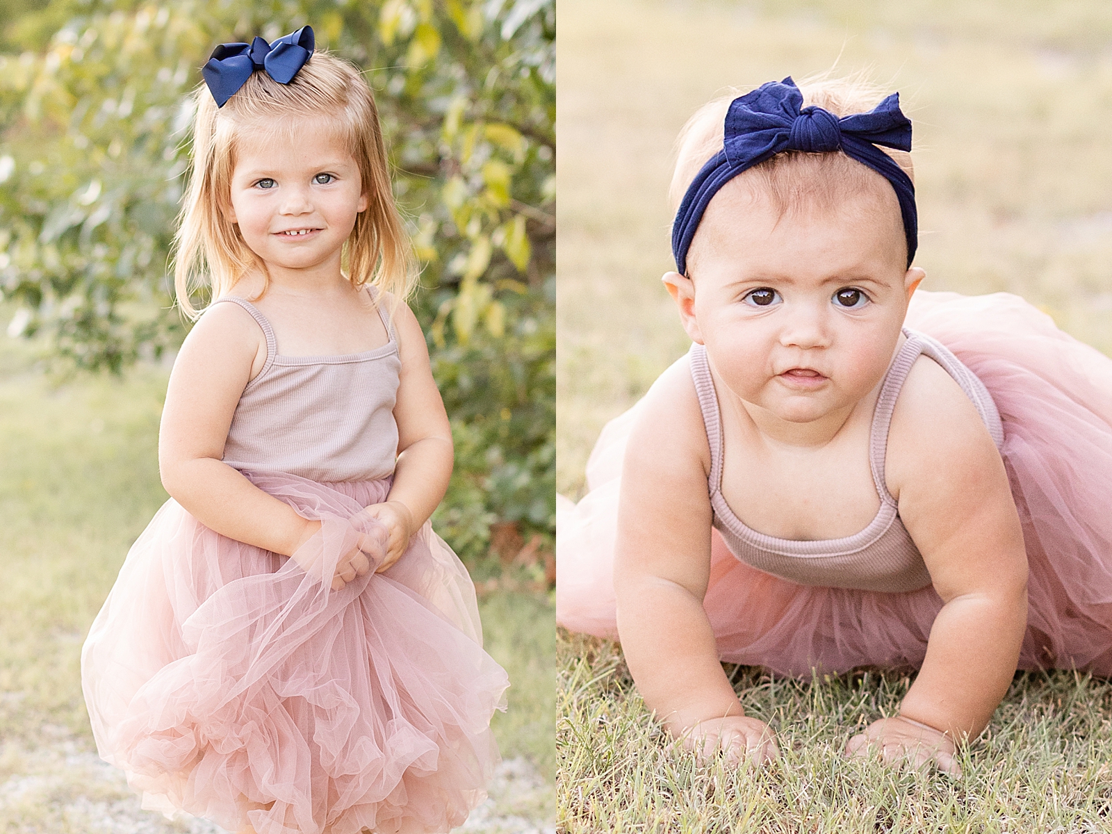 toddler girl smiles at the camera holding dress and baby sister crawls in the grass smiling at the camera