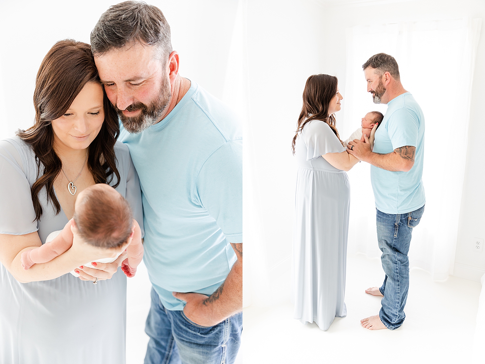 Newborn photos with mom and dad mom wearing light blue gown and dad wearing blur pans and a light blue shirt holding baby and smiling at each other and at baby