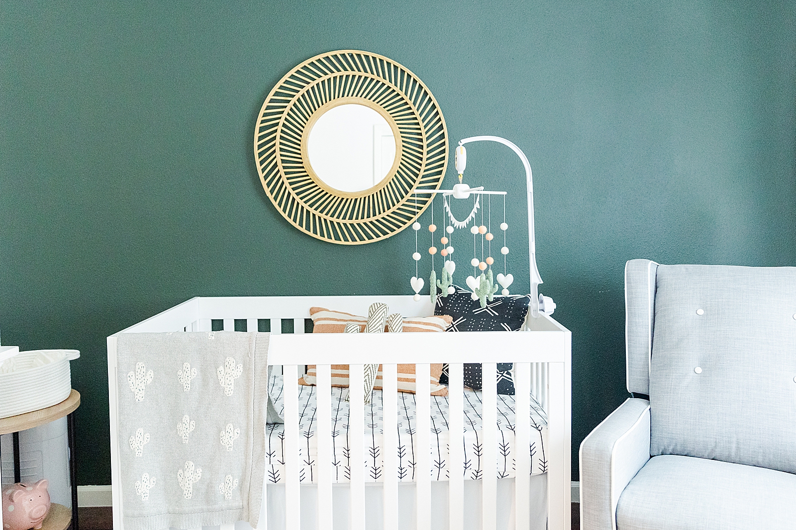 cactus theme nursery white crib cactus mobile and gold mirror with green accent wall
