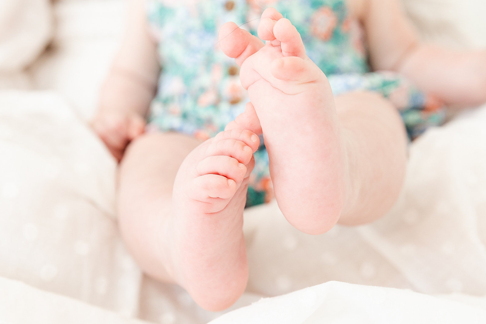 close up of 6 month old baby girl feet